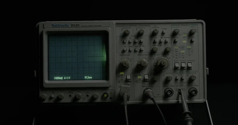 A monitor with a screen showing a heartbeat rhythm