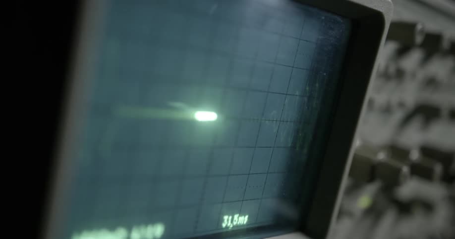 A pulsating line of light flashes across an instrument monitor