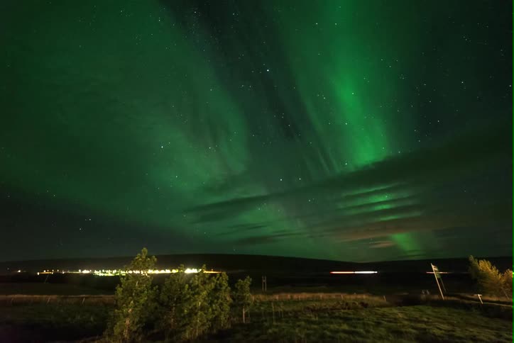 View of northern lights over plains at night