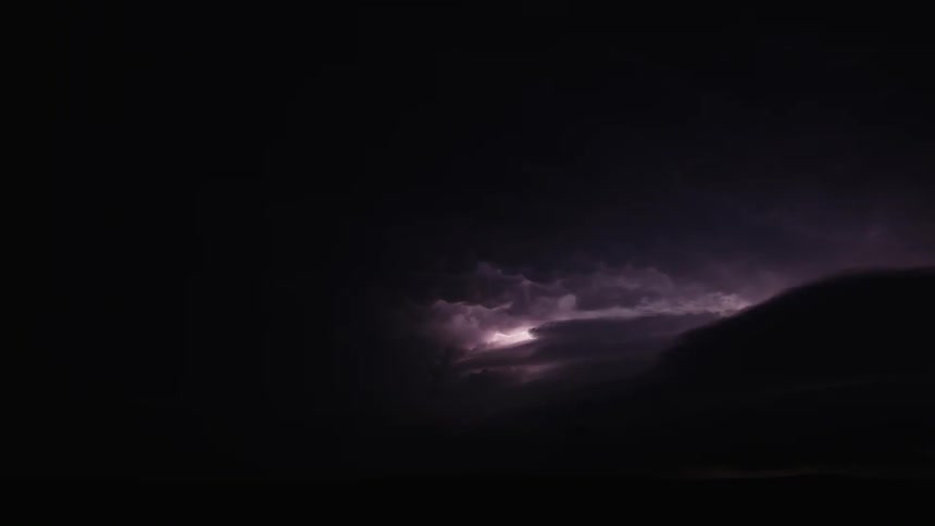 Lightning flashes in the night sky