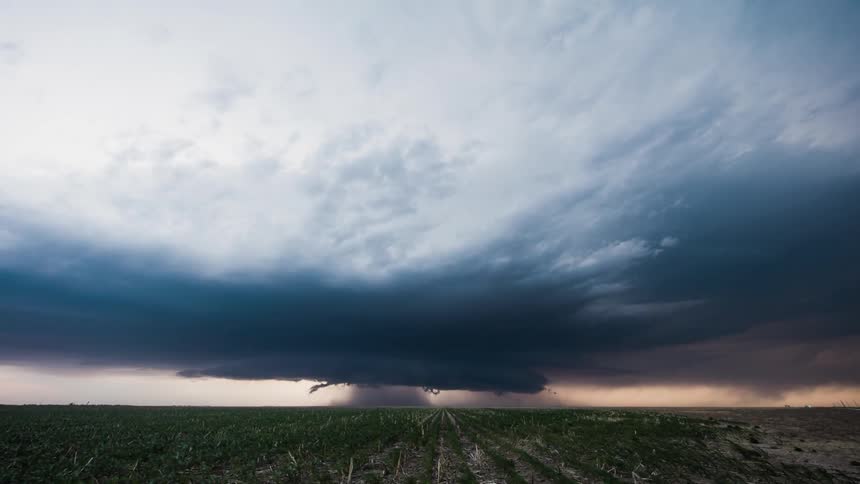 Clouds form in the distance into a storm