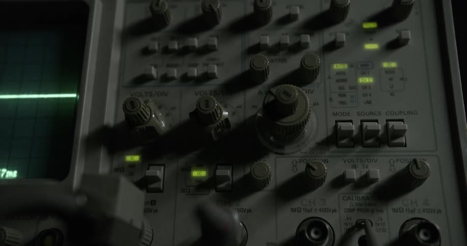 Close up of a monitor with knobs and buttons