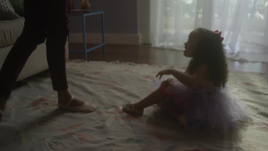 A woman helps her daughter up