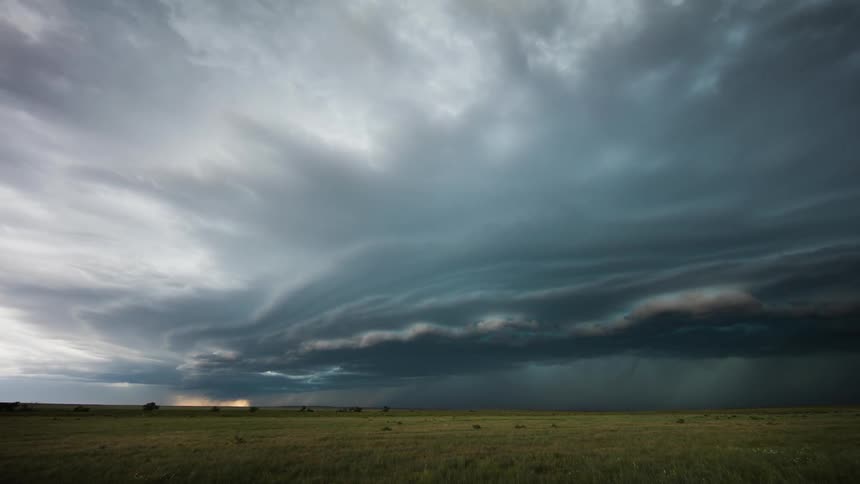 Time lapse of clouds rolling over plains