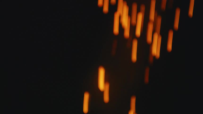 A firework rocket is lit with a lighter and launched into the night sky in a dramatic slow-motion close-up