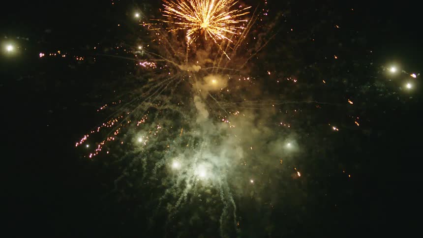 Fireworks and Celebration on a Beach and In a Suburban Neighborhood