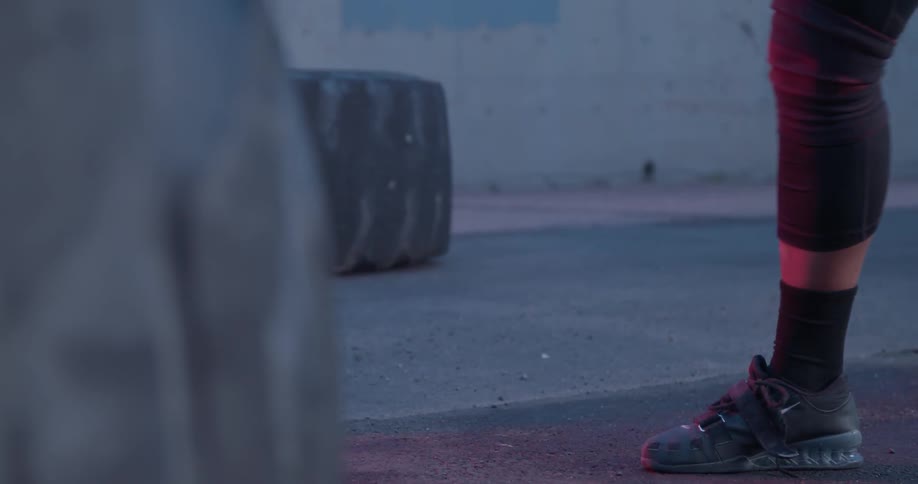Person lifts a barbell and drops it to the ground