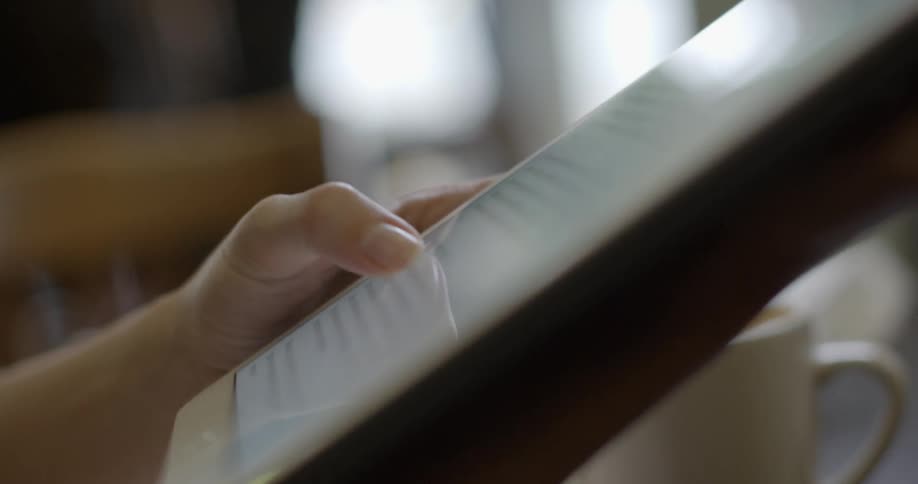 A person is using their tablet