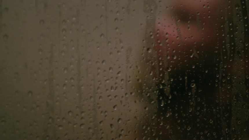 A man washes himself in the shower