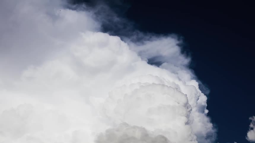 Smoke rises and billows into the air
