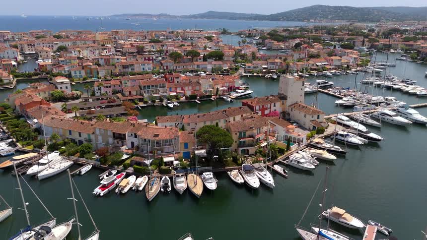 A stunning aerial view of the beautiful marina and canals of Port Grimaud, a charming seaside village on the French Riviera