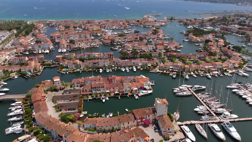 A stunning aerial view of the seaside town and marina of Port Grimaud, France, with its Venice-like canals and docked luxury yachts