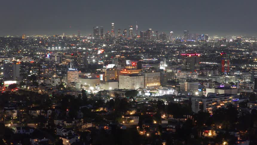 An expansive timelapse of the glowing Hollywood and Downtown Los Angeles cityscapes at night