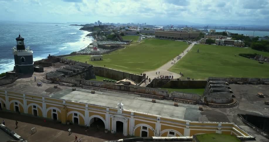 Aerial view of a large building next to the sea