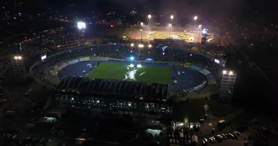A light show lights up the field in a stadium
