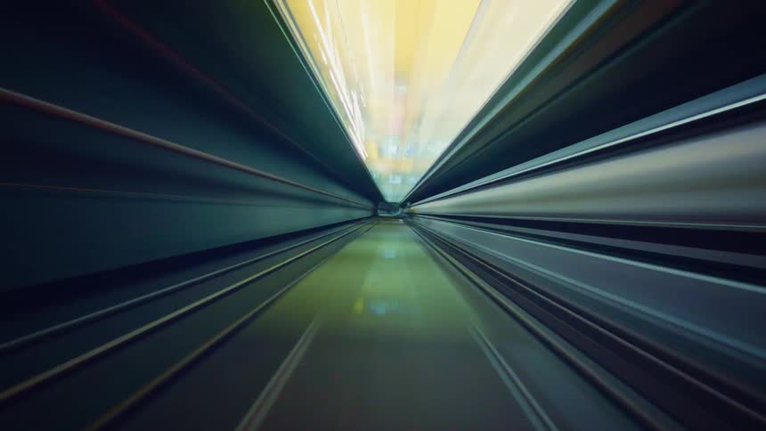 A mesmerizing hyper-lapse journey from the point of view of a train speeding through a futuristic subway tunnel with colorful lights blurring into abstract streaks