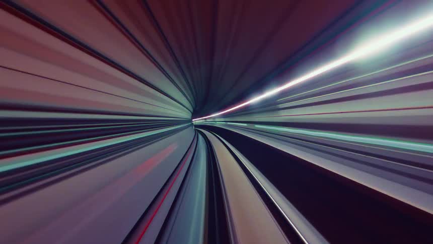 An abstract POV timelapse of a train speeding through a futuristic tunnel with vibrant, colorful light streaks