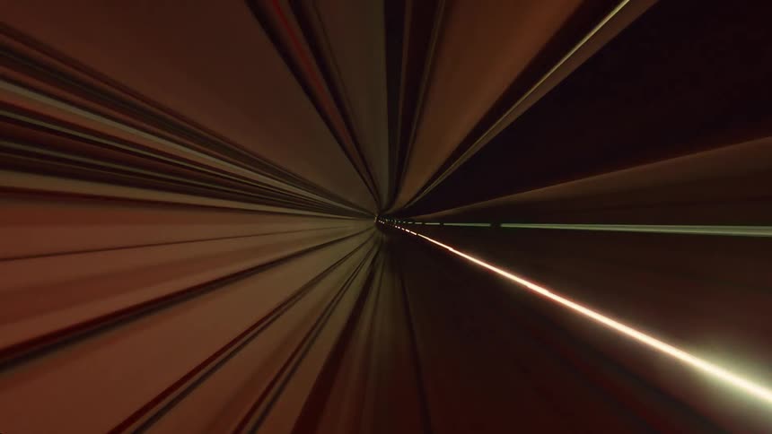 A mesmerizing point-of-view time-lapse shows a high-speed journey through a futuristic tunnel, creating abstract and colorful light trails