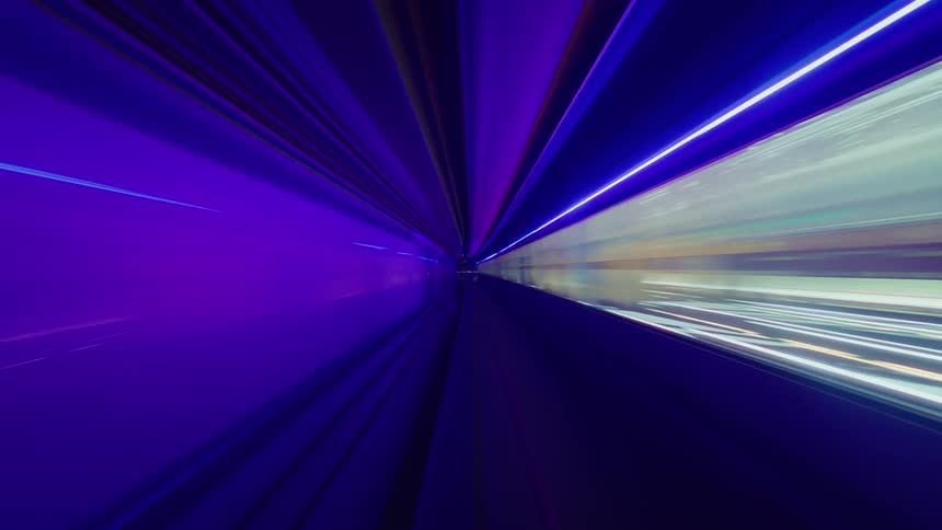A futuristic high-speed journey through an abstract subway tunnel creates mesmerizing light trails and vibrant motion blur