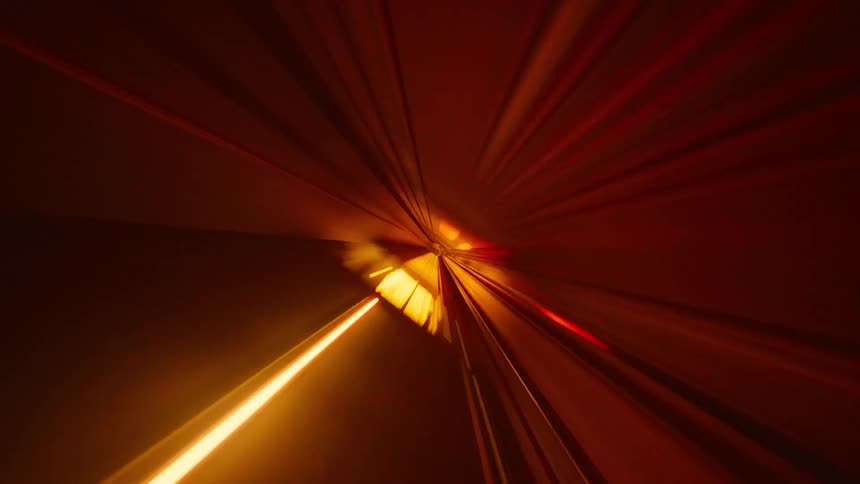 A futuristic POV time-lapse of a subway speeding through a vibrantly lit tunnel, creating a stunning visual of light trails