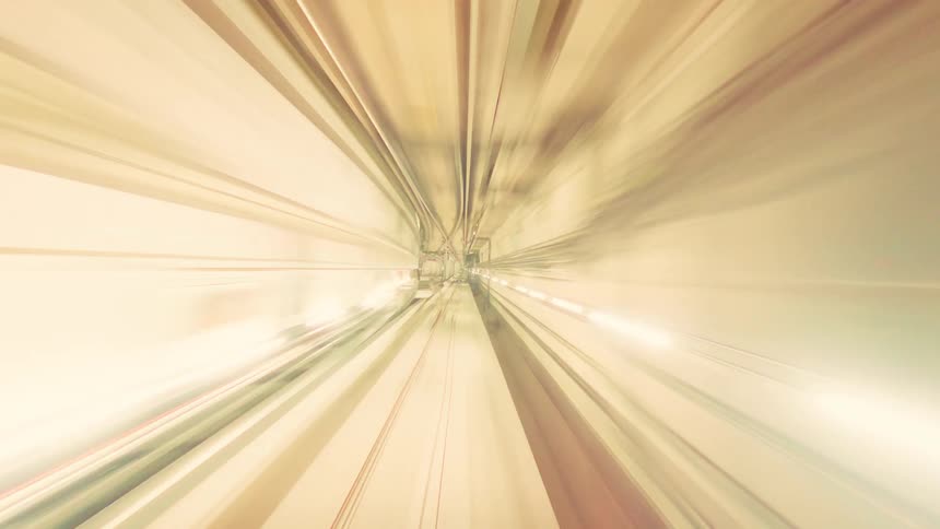 A mesmerizing time-lapse journey through a subway tunnel creates abstract, colorful streaks of light at high speed