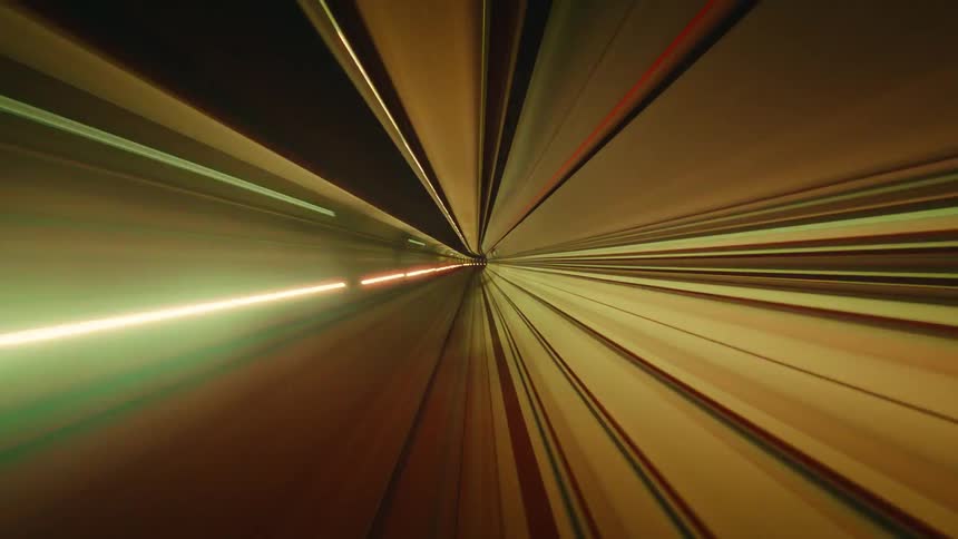 Psychedelic POV time-lapse of a journey through a futuristic subway tunnel, with colorful lights streaking by at high speed