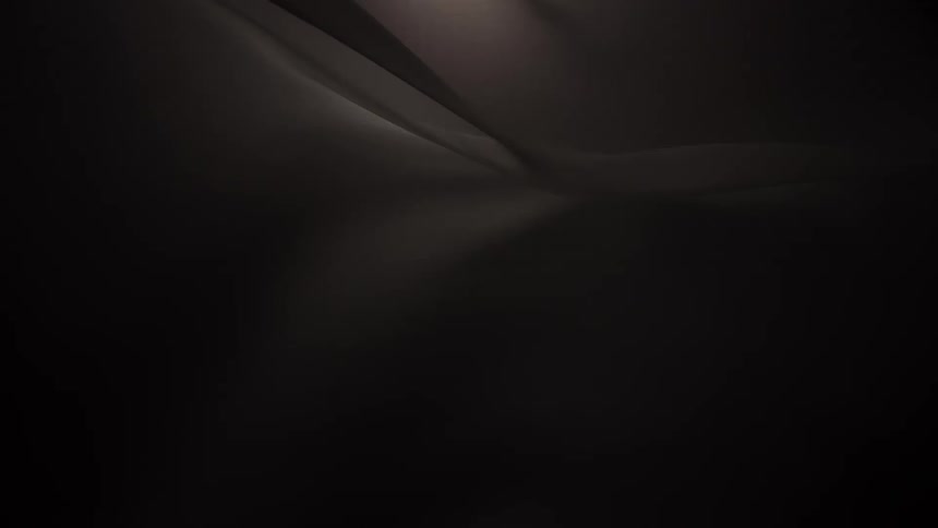 An elegant and abstract background of dark, silky fabric flowing gracefully in slow motion