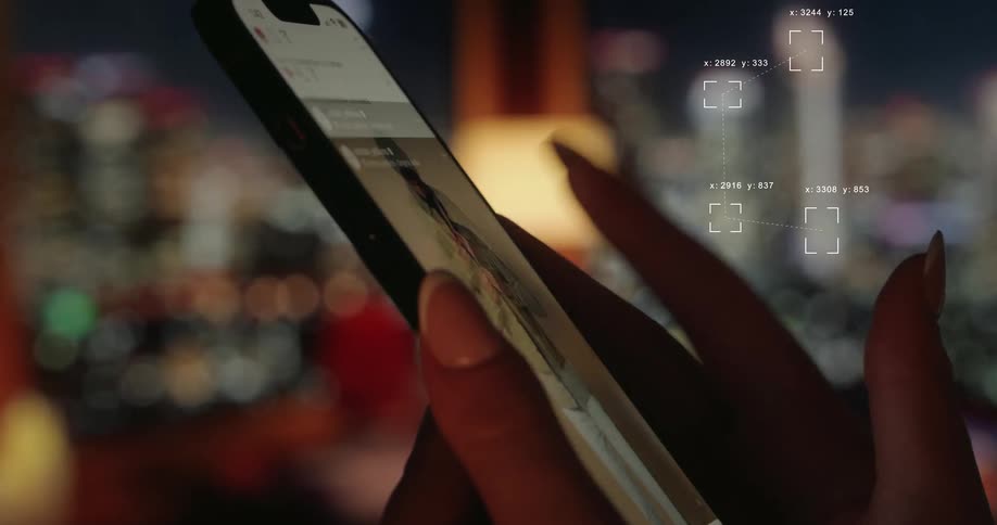 Digital data tracking technology analyzes a social media feed as a user scrolls on their phone with a city skyline at night