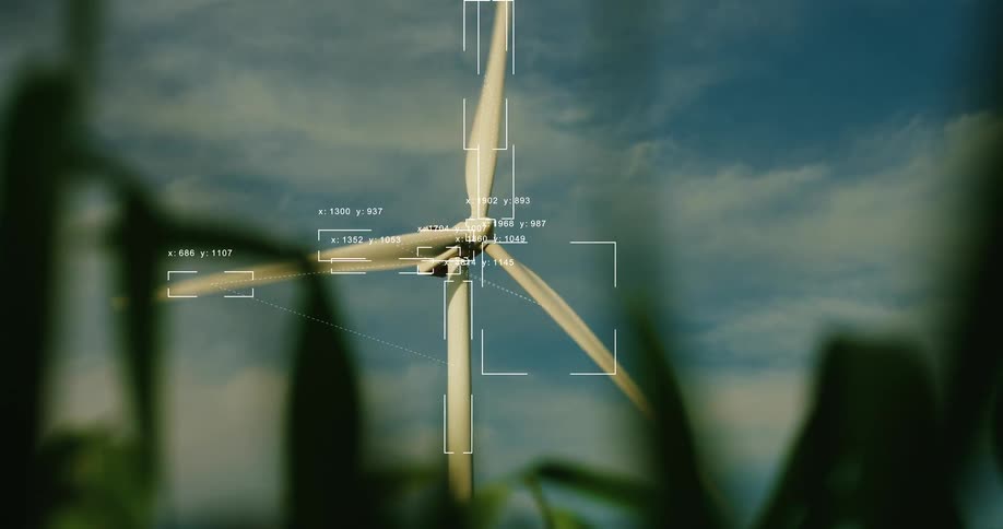 Futuristic AI technology analyzes a spinning wind turbine with a data and tracking overlay from a field