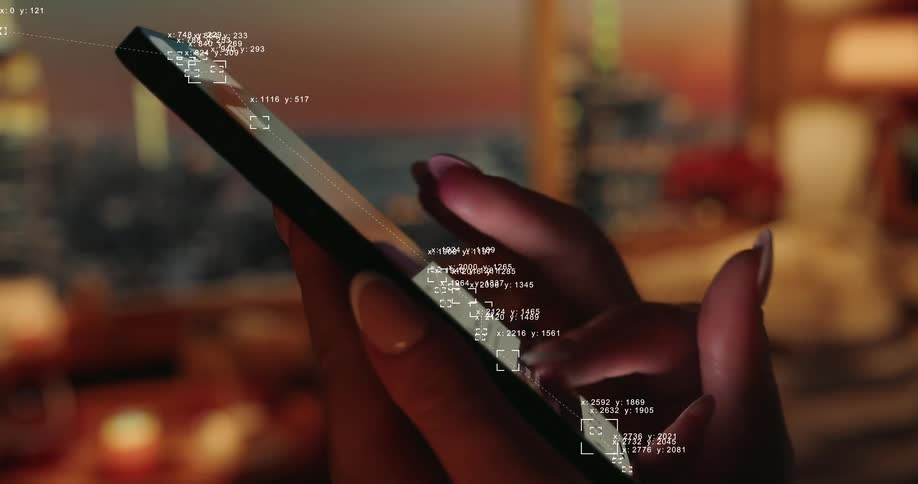 A close-up of a woman's hands scrolling on a smartphone with futuristic digital data overlays tracking her movements