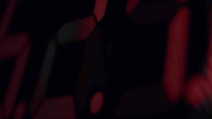 An extreme close-up of a rapidly changing red digital timer on a black display