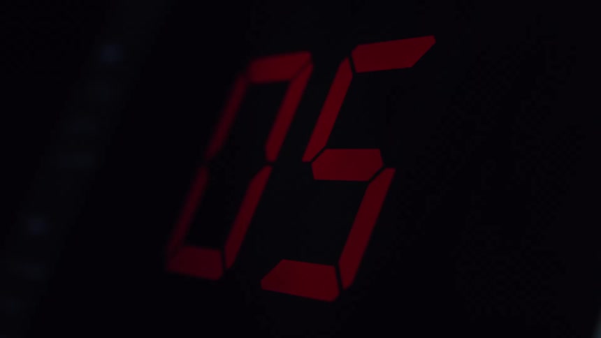 A red digital timer counts down from ten seconds to zero against a dark background