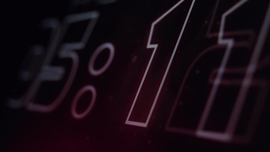 An animated close-up of a futuristic digital timer counting down dramatically
