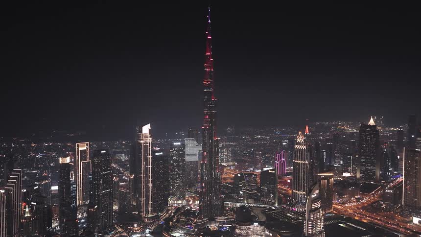 A stunning time-lapse of the iconic Burj Khalifa and the dazzling Dubai skyline illuminated against the night sky