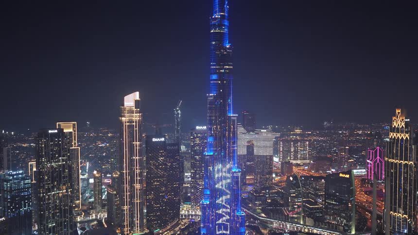 Spectacular aerial view reveals the iconic Burj Khalifa and the glittering Dubai skyline during a dazzling nighttime light show