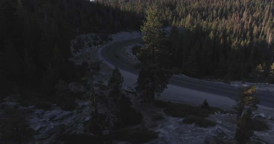 Aerial view of a barren highway at sunset