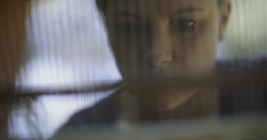 Close up of a woman's face reading a paper
