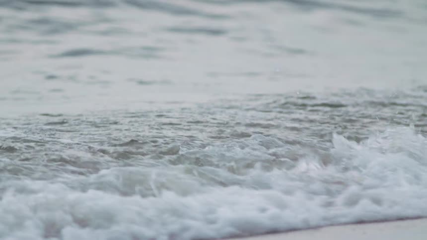 Waves flow onto the sand