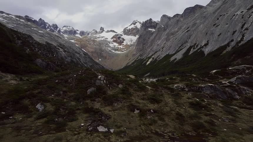 View of snowy mountains and cloudy sky