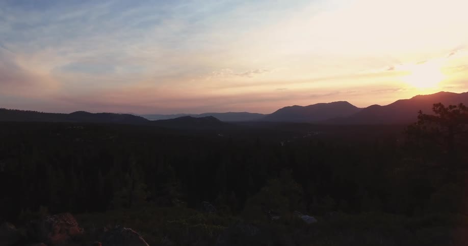 View of hilly landscape at sunset
