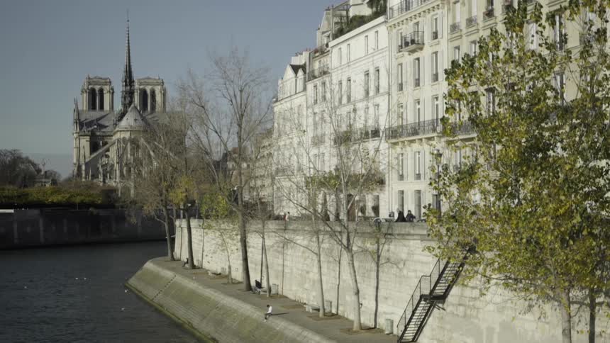 Large building next to a river on a clear day