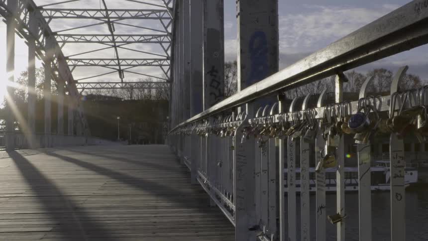 The sun shines atop a bridge crossway