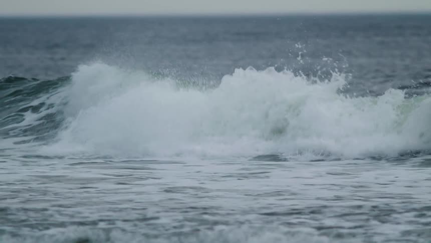 Ocean waves rolling to shore
