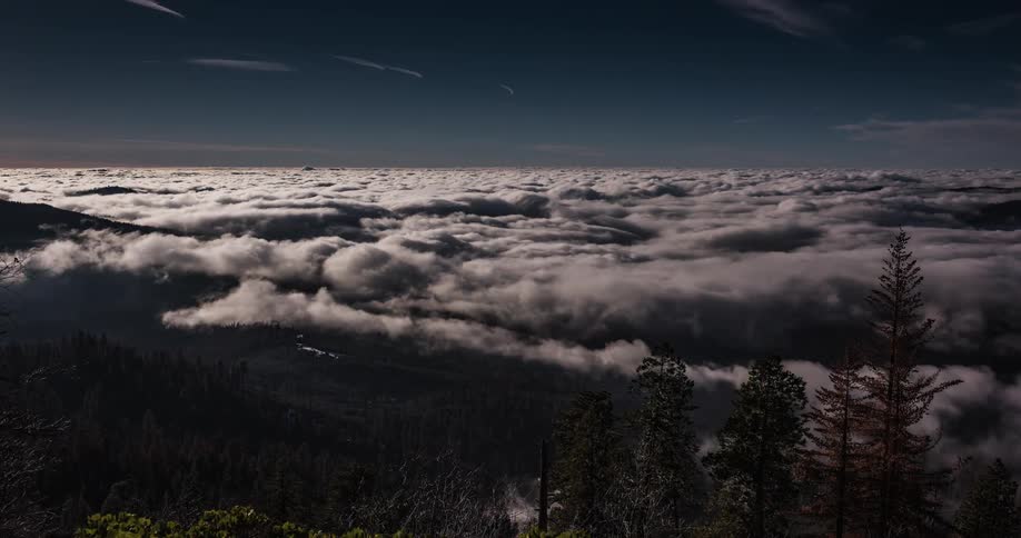 Thick clouds moving over mountain wilderness