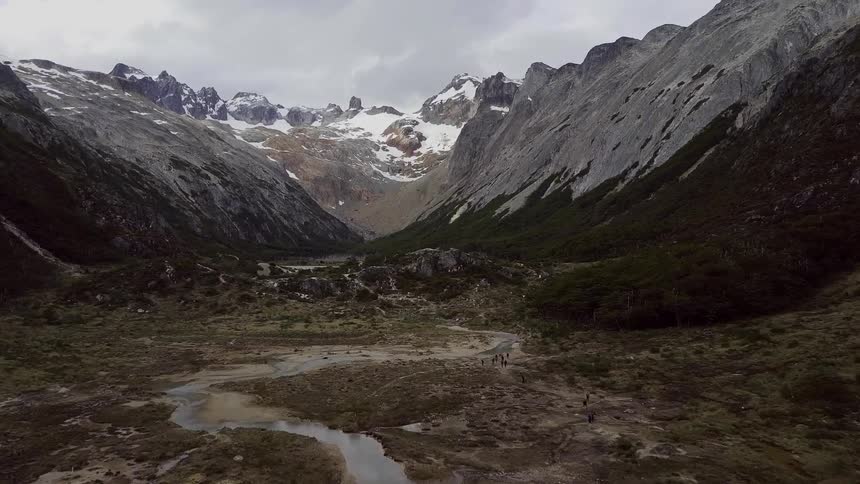The mountain range has water up to its edge below