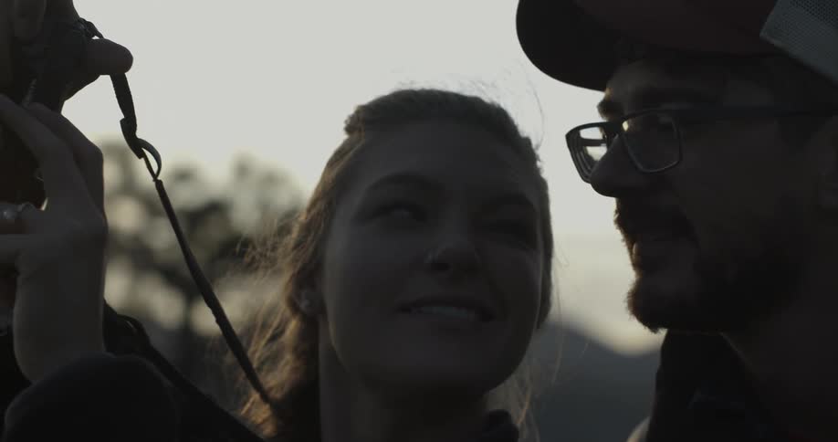A man and woman examine a horse together