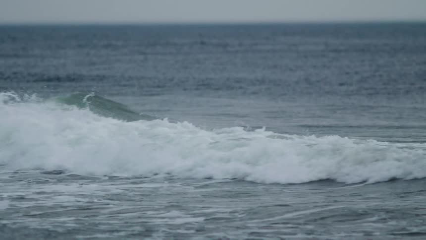 Ocean waves rolling to shore