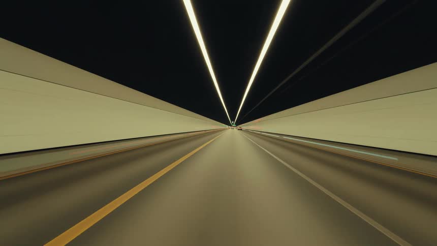 A futuristic time-lapse journey through an illuminated highway tunnel at high speed