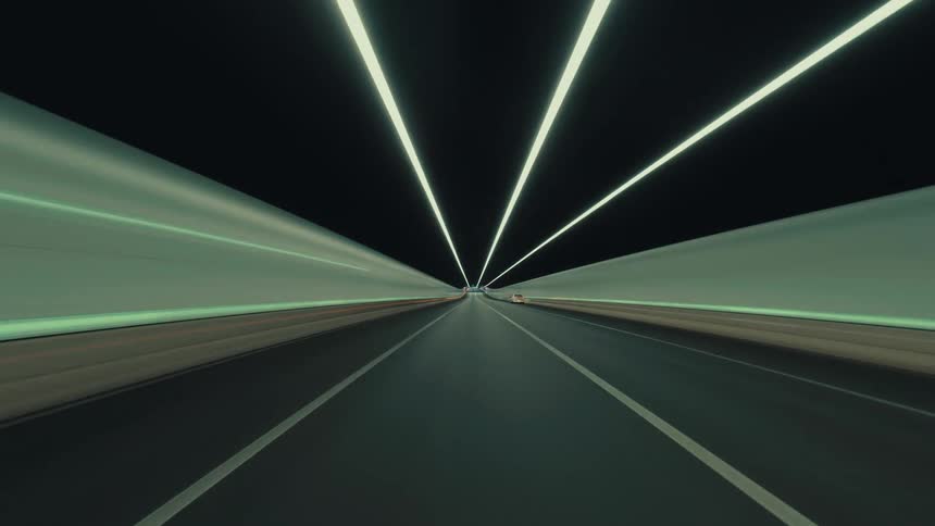 A stylized hyper-lapse journey from a driver's perspective on a city highway at dusk, speeding through a brightly lit tunnel