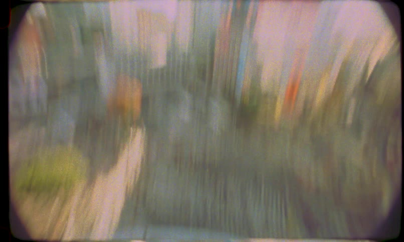 A dreamy, vintage high-angle shot captures the iconic Shibuya Crossing in Tokyo with a distorted fisheye effect and fast motion blur
